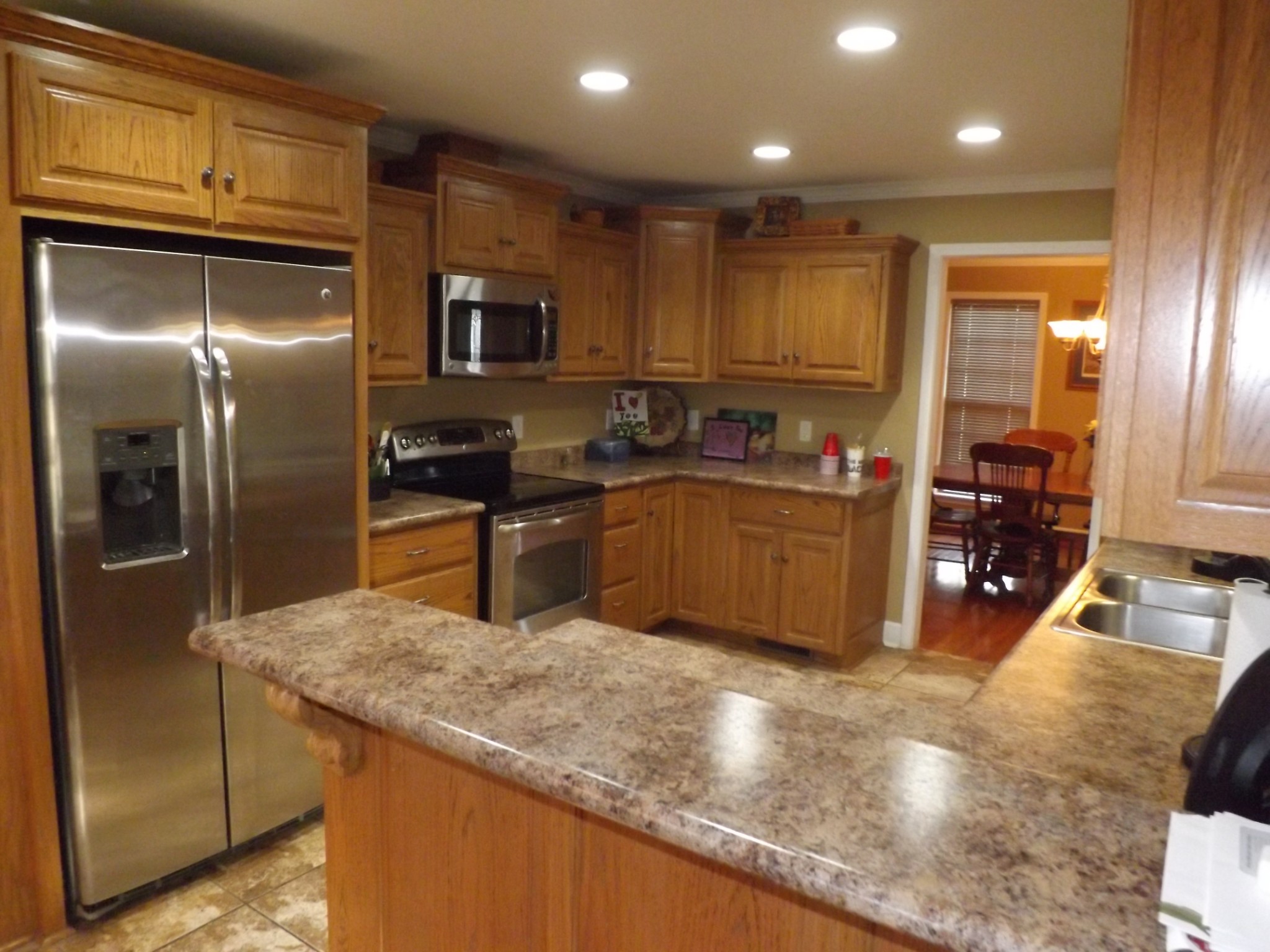 2591 Briar Patch Road Prospect, TN 38477 - Photo 12 of 48 a kitchen with stainless steel appliances granite countertop a sink a stove and a refrigerator