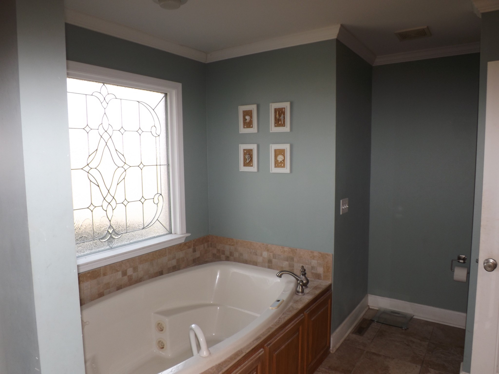 2591 Briar Patch Road Prospect, TN 38477 - Photo 17 of 48 a bath tub sitting in a bathroom next to a window