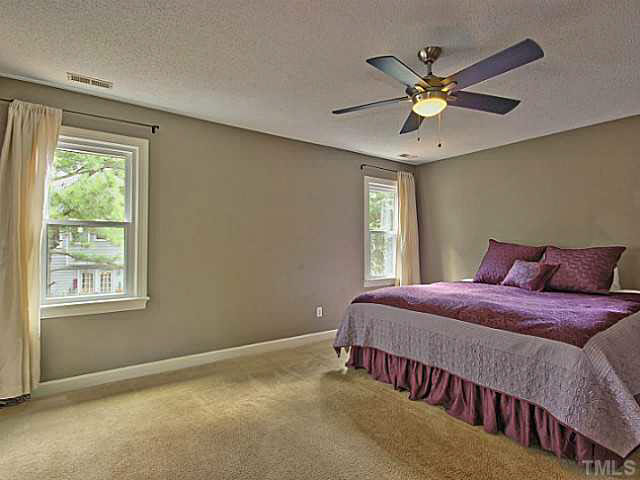 2405 Cookshire Drive Raleigh, NC 27604 - Photo 11 of 25 Your master bedroom is HUGE. It has carpet, ceiling fan and his and her closets.