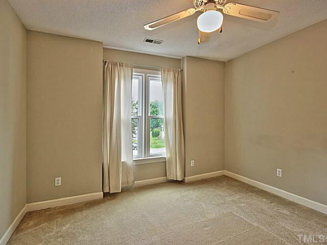 2405 Cookshire Drive Raleigh, NC 27604 - Photo 17 of 25 Bedroom 3 is the same size as 2 and would make a great in home office.
