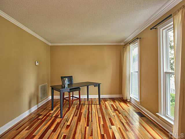 2405 Cookshire Drive Raleigh, NC 27604 - Photo 4 of 25 To your right you have your formal living room. It has brand new paint & base boards. This is a great place to cuddle up with a good book.
