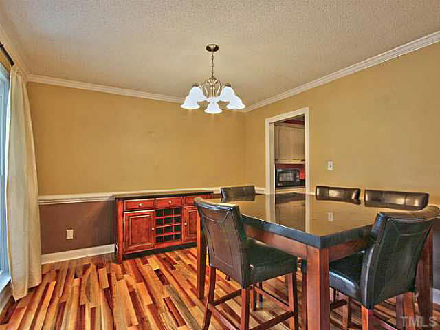 2405 Cookshire Drive Raleigh, NC 27604 - Photo 5 of 25 To your left is your formal dining room. It opens into your kitchen and has molding, new paint & baseboards.