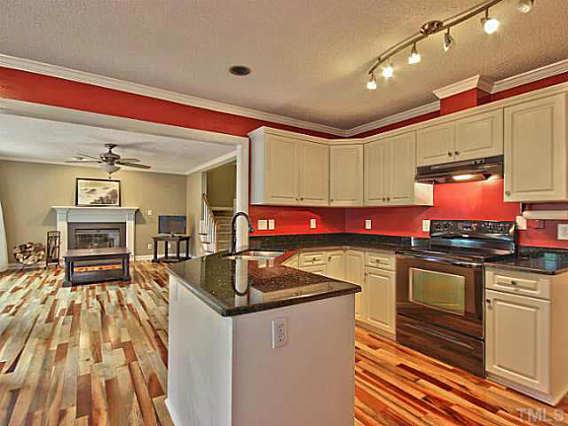 2405 Cookshire Drive Raleigh, NC 27604 - Photo 6 of 25 Your kitchen has granite counter tops, track lighting, new faucet & tons of cabinet space.