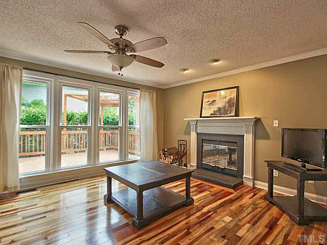 2405 Cookshire Drive Raleigh, NC 27604 - Photo 10 of 25 Your family room has the access and the view to your new deck and private backyard.