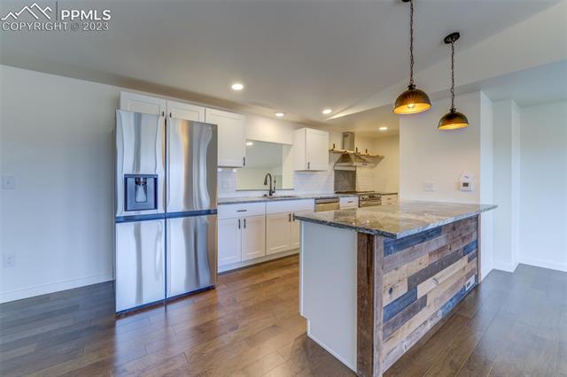 12610 North Condor Road Peyton, CO 80831 - Photo 10 of 34 Leading into the glorious galley kitchen