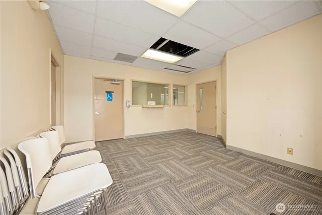 a view of a room with wooden floor and small space