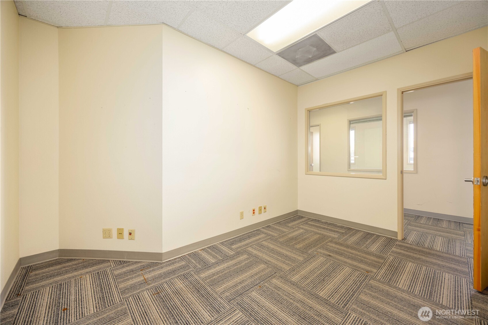 325 North Chelan Avenue, Unit A Wenatchee, WA 98801 - Photo 20 of 28 a view of a room with wooden floor and brick wall