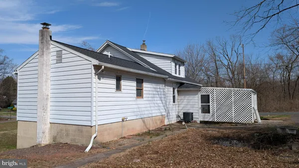 a view of a house with a yard and garage