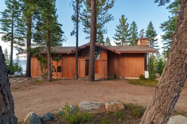 a view of a kitchen with furniture and a large window
