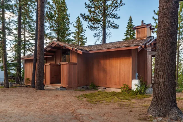 a bedroom with a bed and a lamp