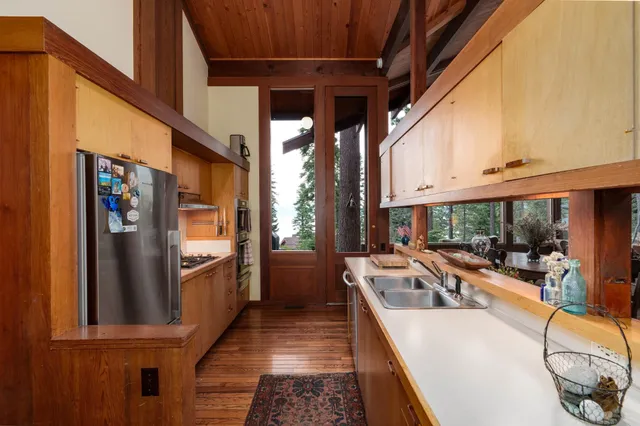 a bathroom with a tub and a double vanity sink