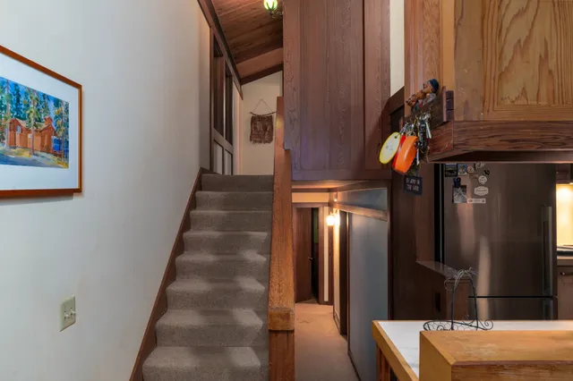 a bedroom with a bed and a mirror