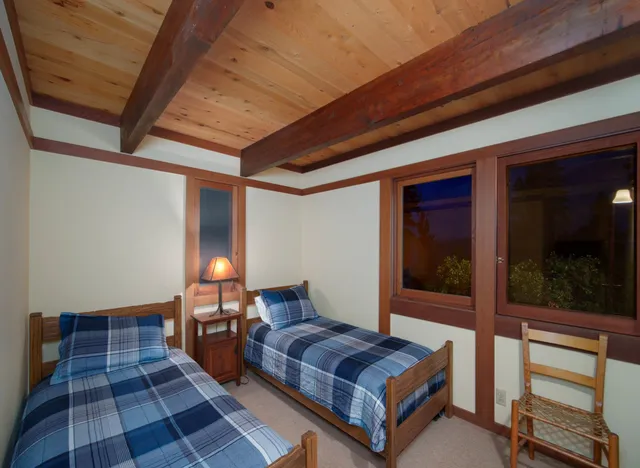 a view of a patio with chairs and a table