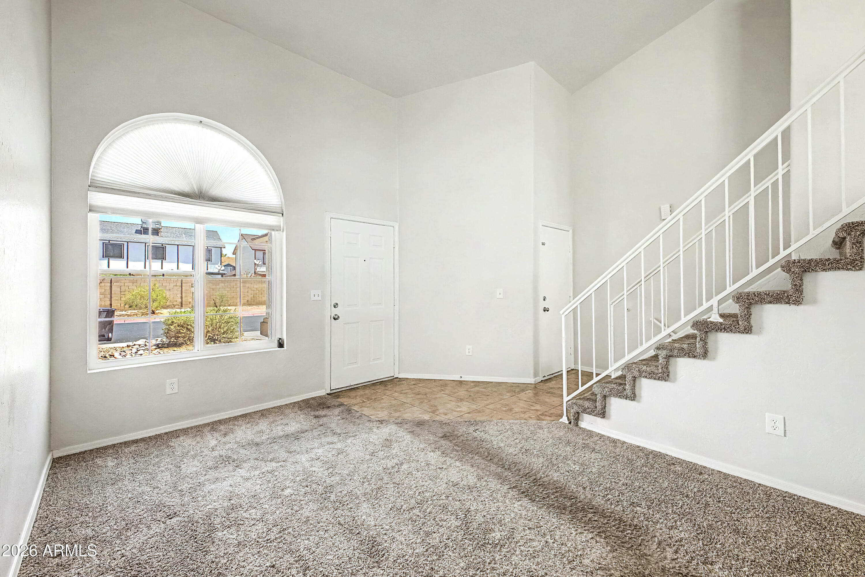 3134 East McKellips Road, Unit 221 Mesa, AZ 85213 - Photo 3 of 29 a view of an empty room with staircase