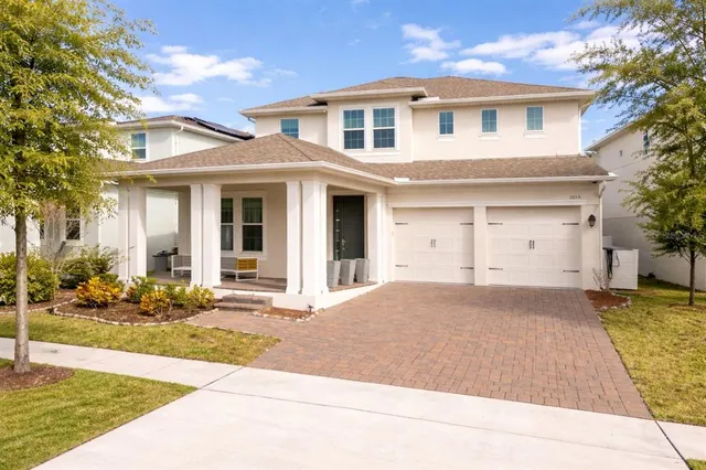 an aerial view of residential houses with outdoor space and swimming pool