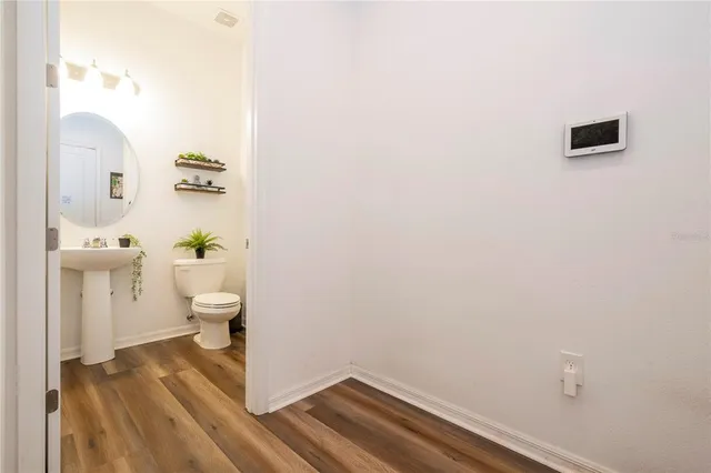 a bathroom with a sink a mirror and a shower