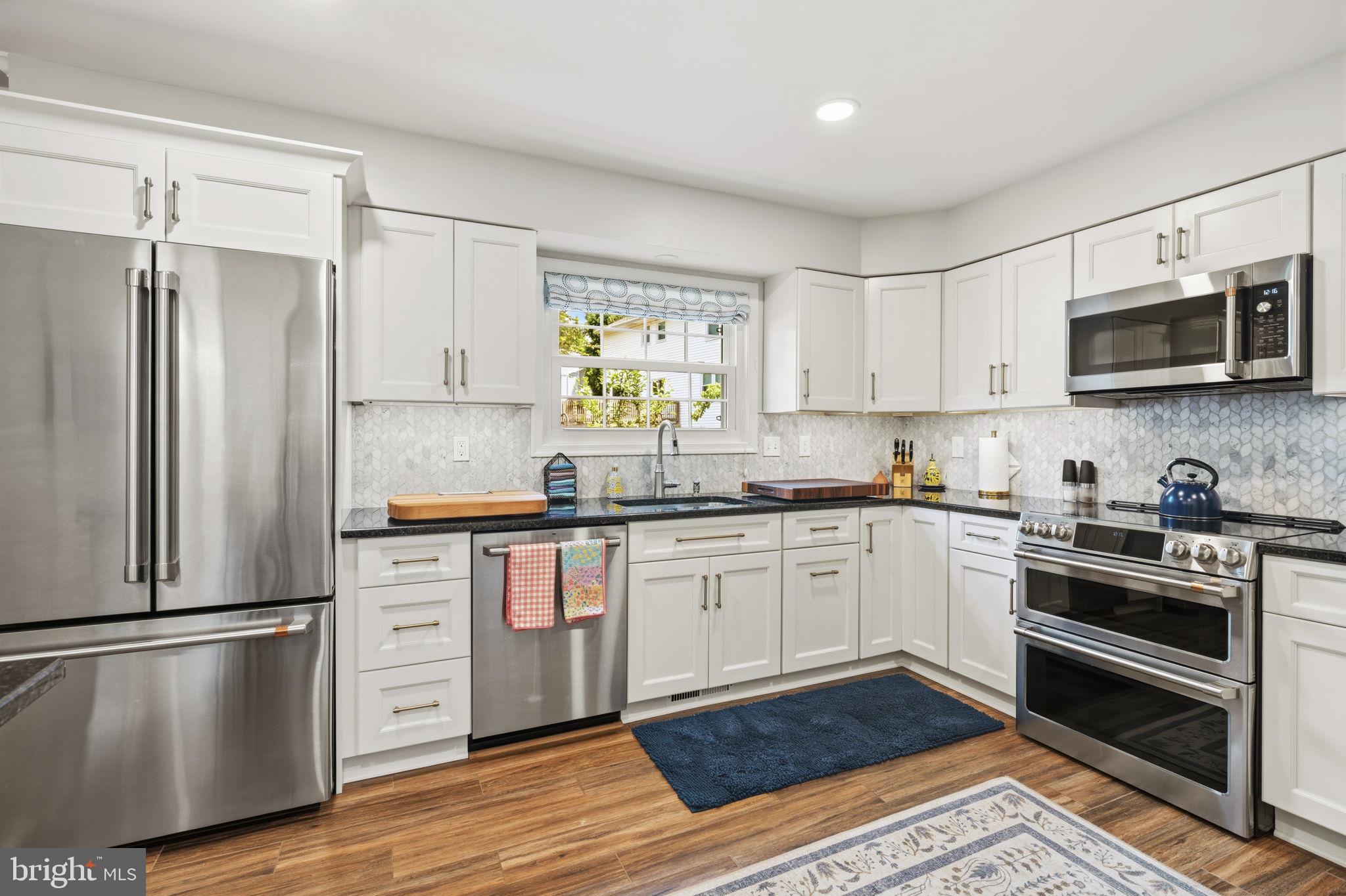 502 North Shamrock Road Bel Air, MD 21014 - Photo 10 of 46 Kitchen w/white cabinetry & granite countertops