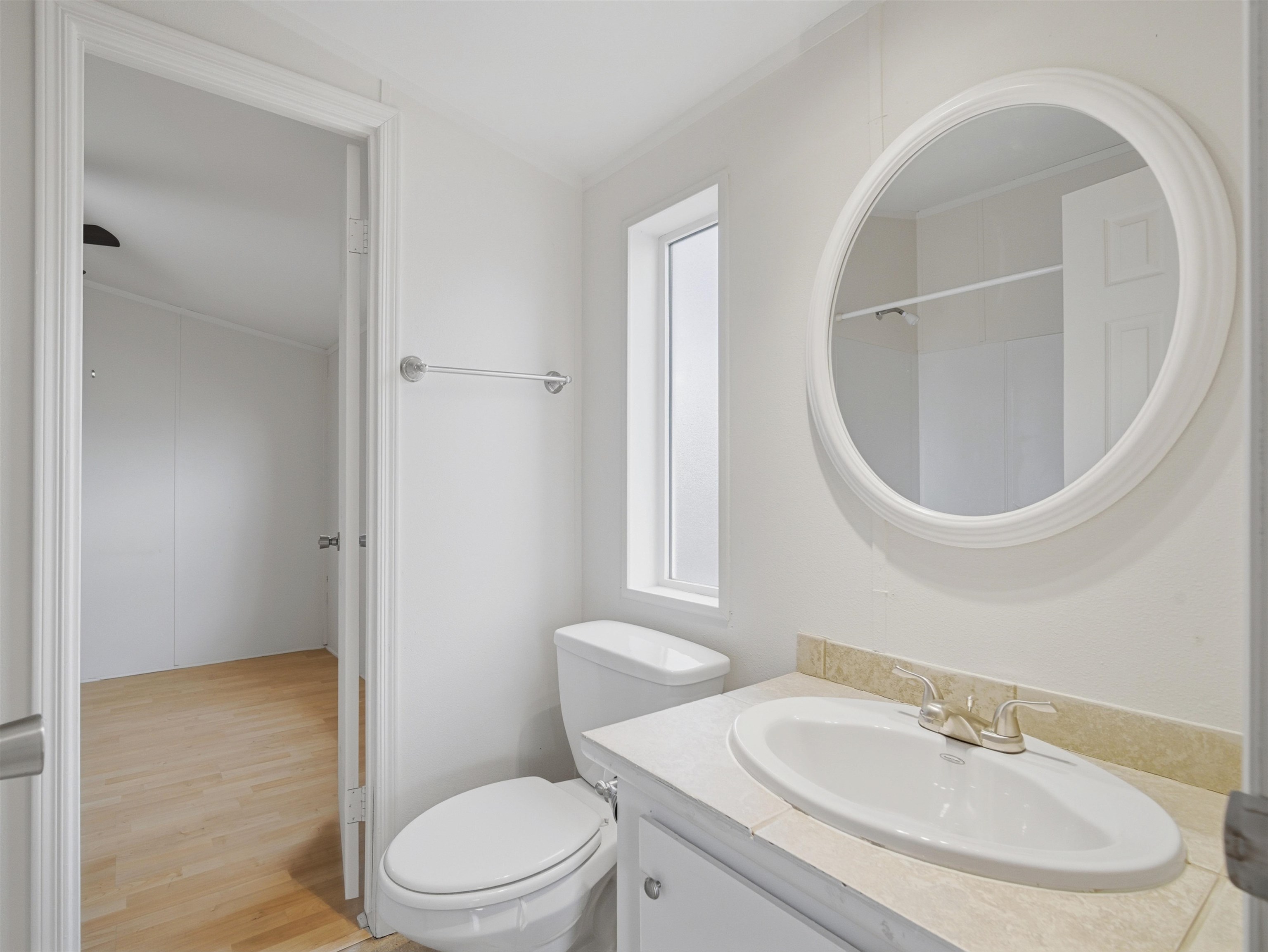 435 32 Road, Unit 832 Clifton, CO 81520 - Photo 15 of 25 a bathroom with a sink a toilet and a mirror