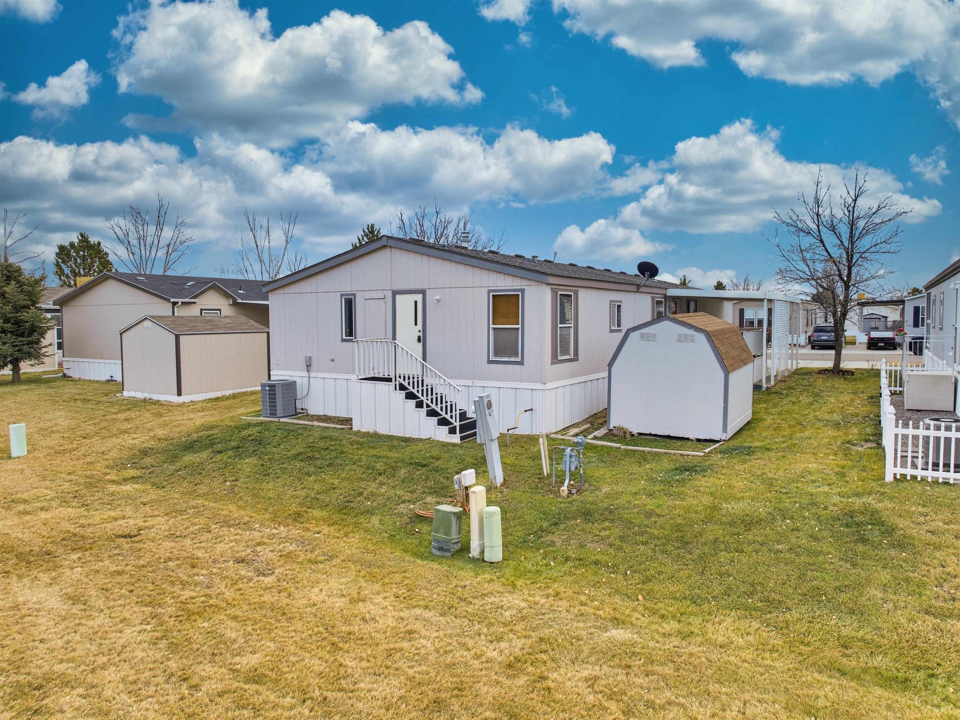 435 32 Road, Unit 832 Clifton, CO 81520 - Photo 21 of 25 a view of a house with a yard