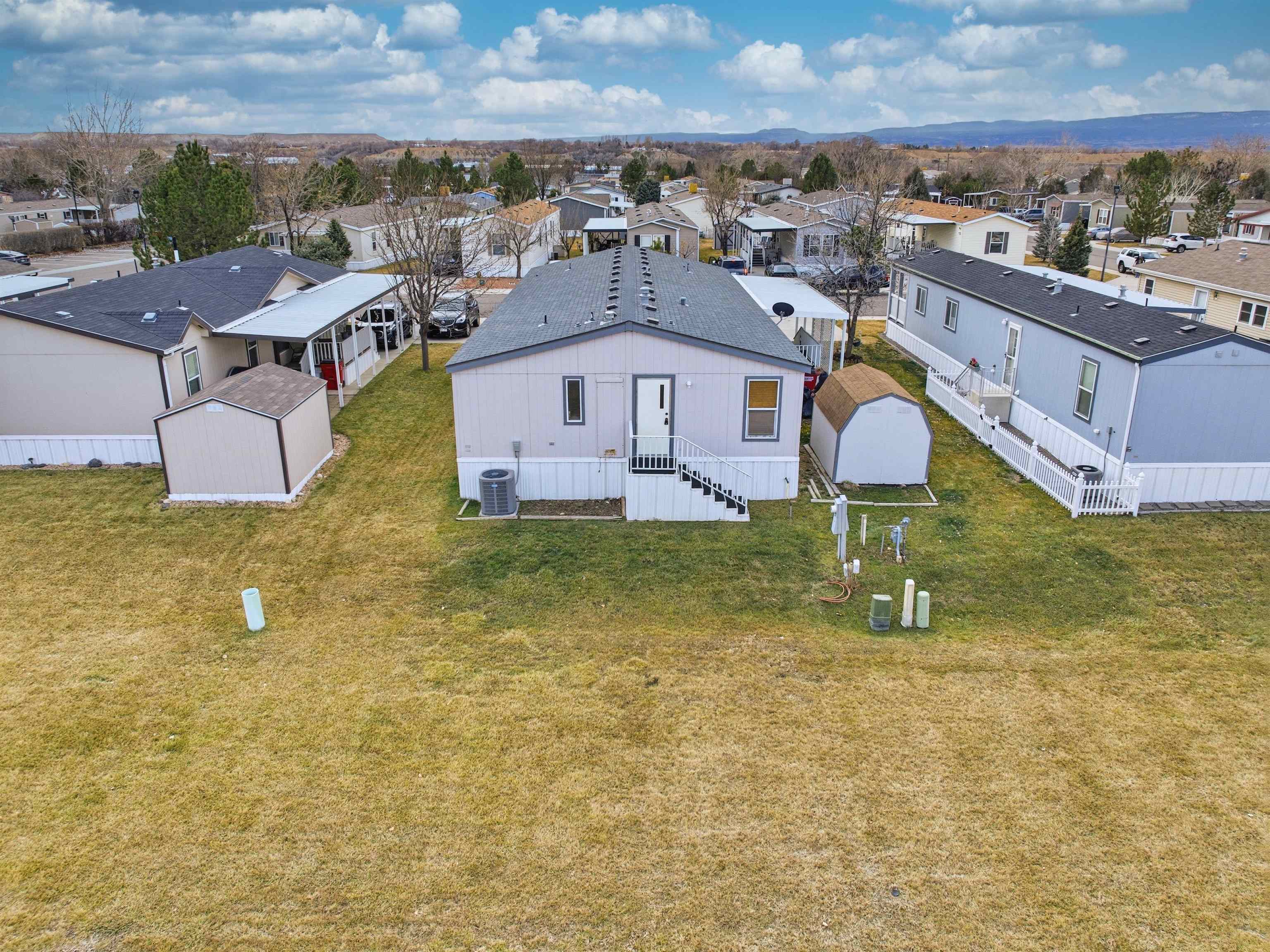 435 32 Road, Unit 832 Clifton, CO 81520 - Photo 22 of 25 an aerial view of residential houses with outdoor space and swimming pool