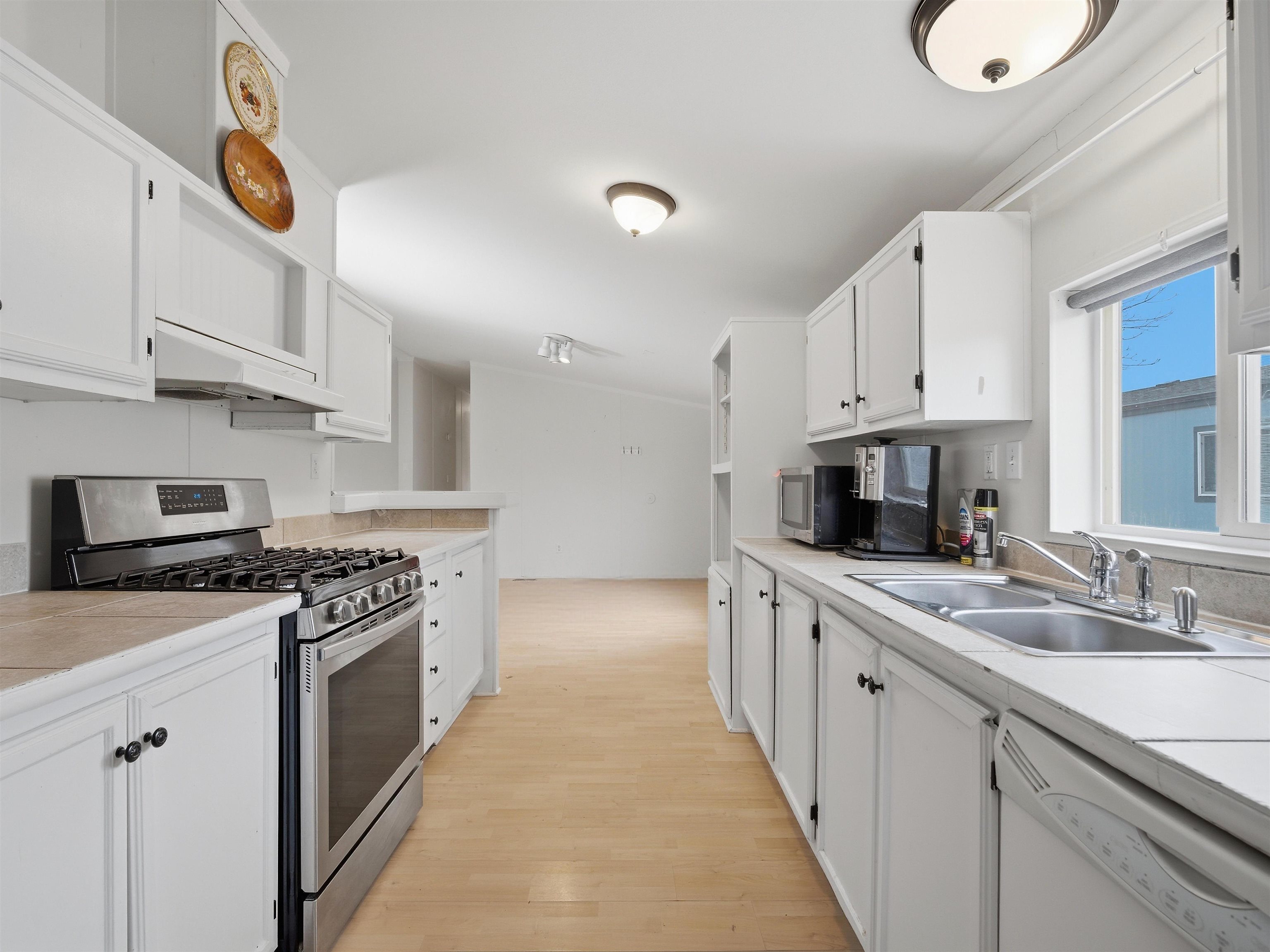 435 32 Road, Unit 832 Clifton, CO 81520 - Photo 3 of 25 a kitchen with stainless steel appliances granite countertop a lot of counter space and a sink