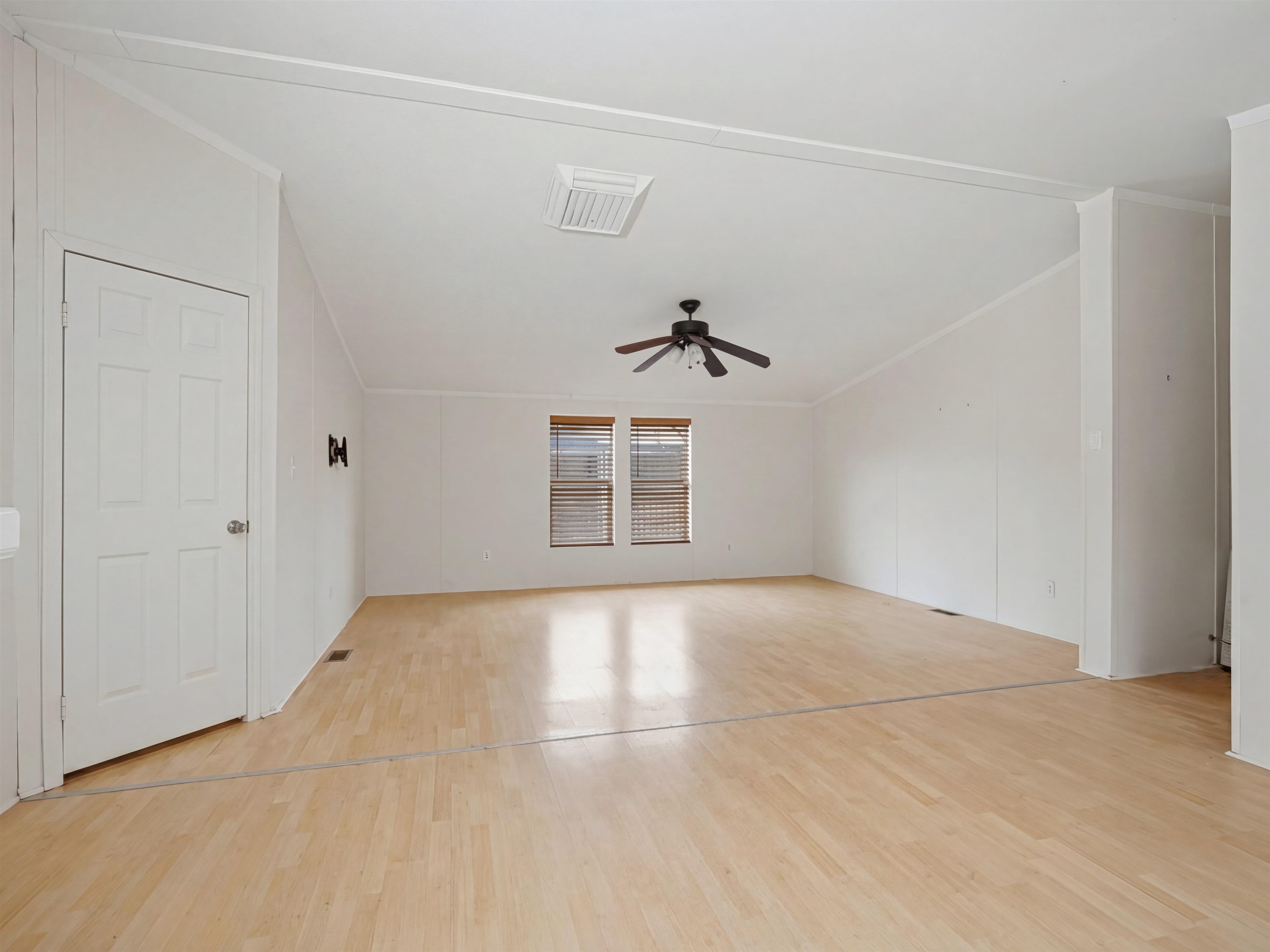 435 32 Road, Unit 832 Clifton, CO 81520 - Photo 6 of 25 an empty room with windows and ceiling fan