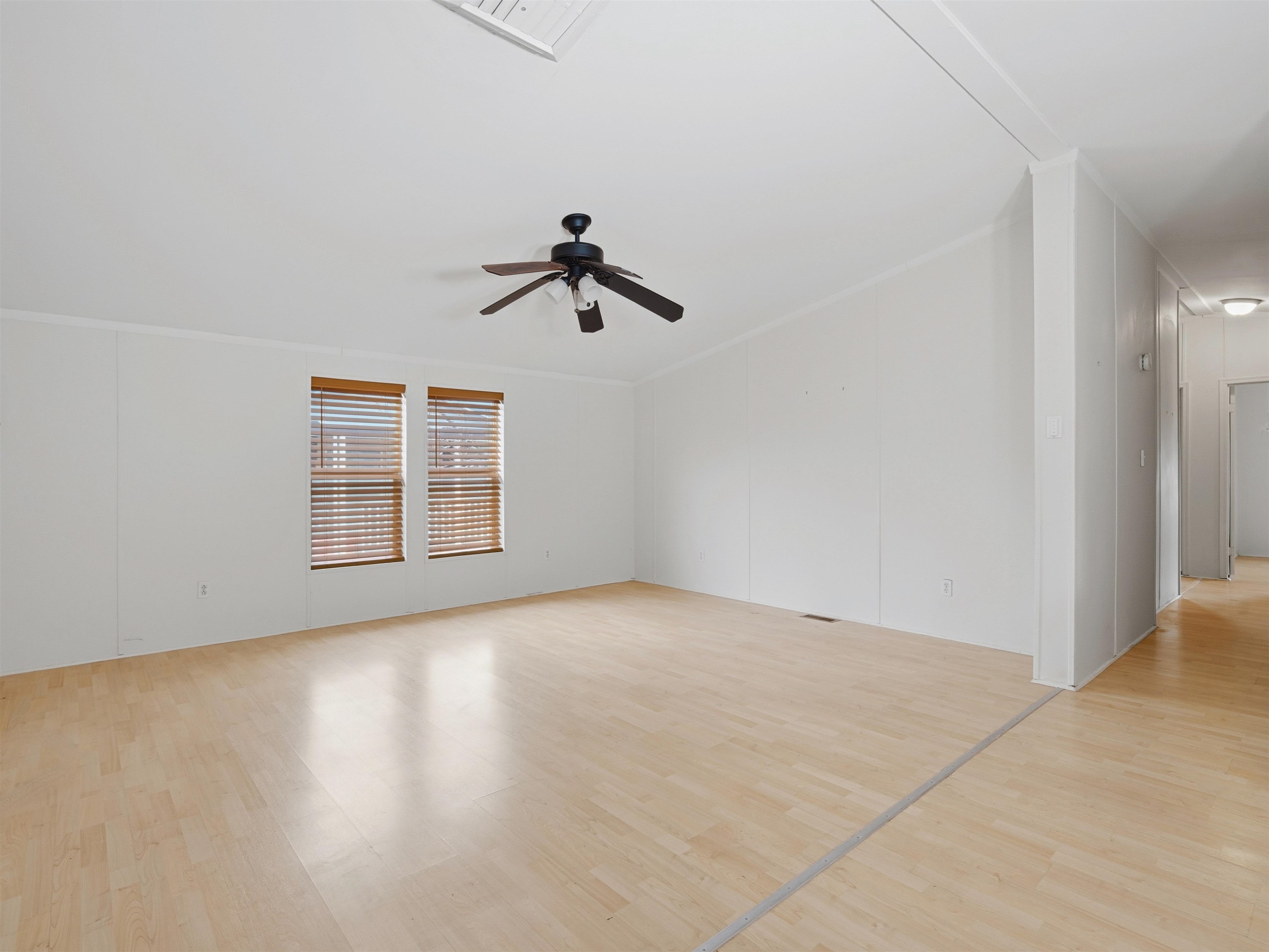 435 32 Road, Unit 832 Clifton, CO 81520 - Photo 7 of 25 an empty room with windows and ceiling fan view