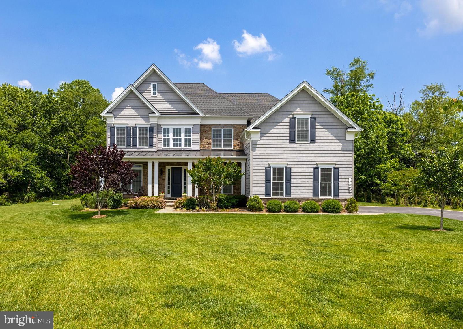 14309 Oak Meadow Road Baldwin, MD 21013 - Photo 1 of 102 a front view of a house with a yard