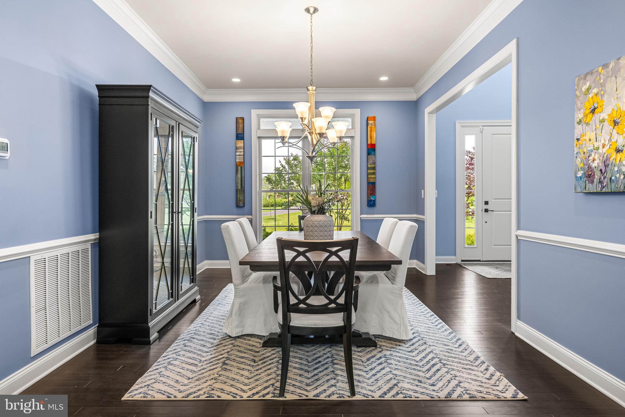 14309 Oak Meadow Road Baldwin, MD 21013 - Photo 23 of 102 a dining room with furniture a rug and wooden floor