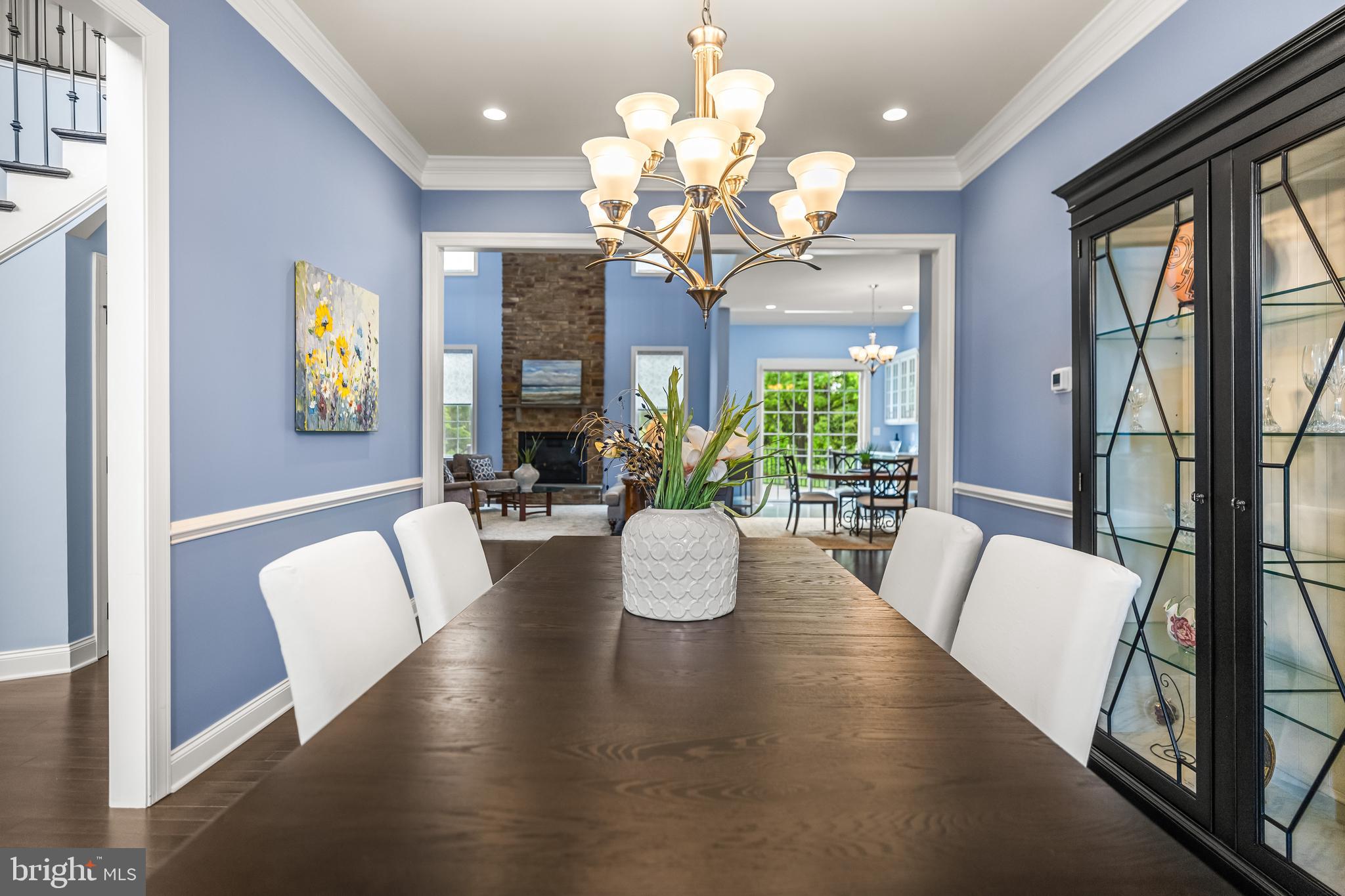 14309 Oak Meadow Road Baldwin, MD 21013 - Photo 26 of 102 a view of a dining room with furniture a chandelier and large windows