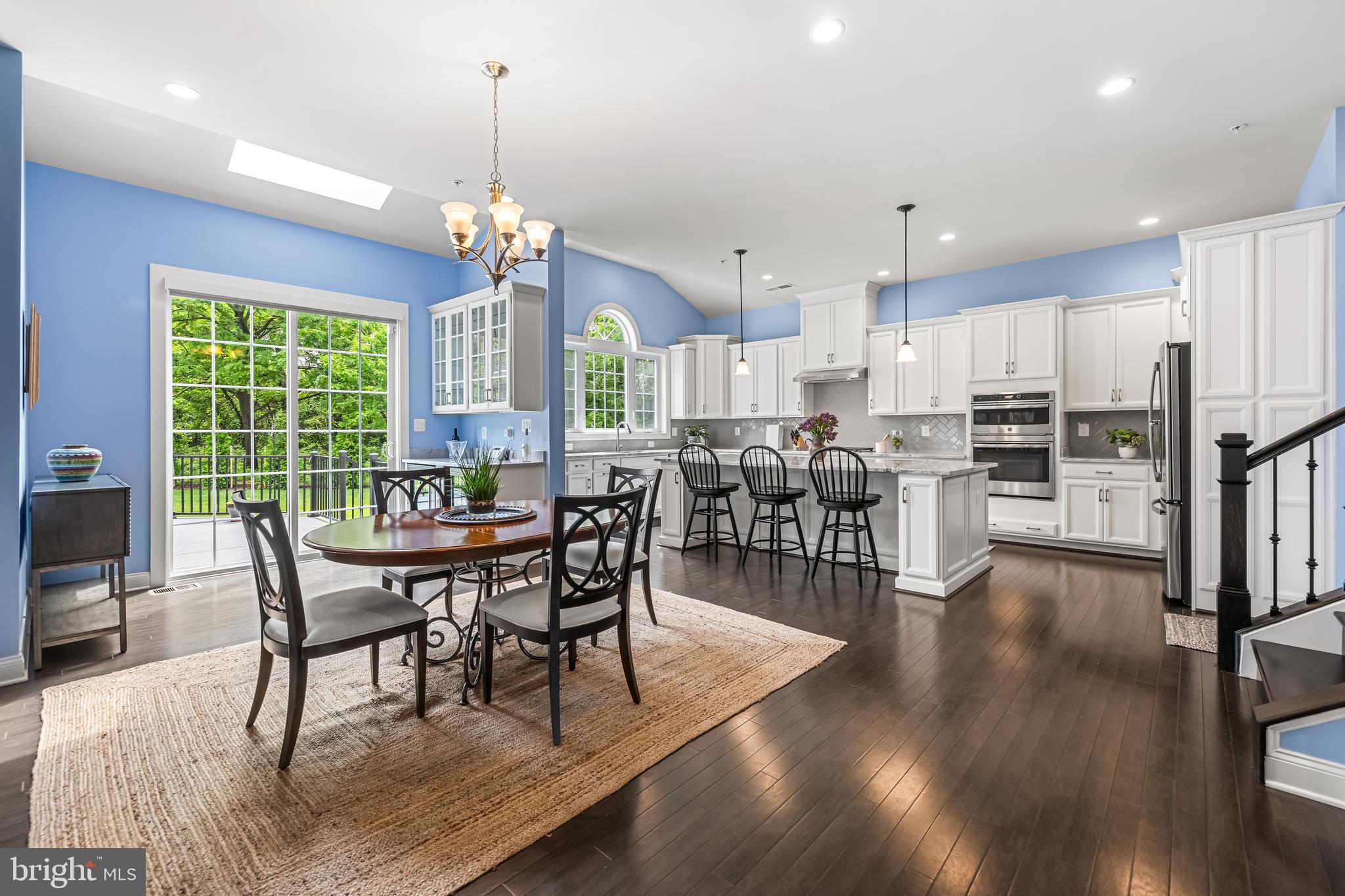 14309 Oak Meadow Road Baldwin, MD 21013 - Photo 31 of 102 a view of a dining room with furniture window and wooden floor
