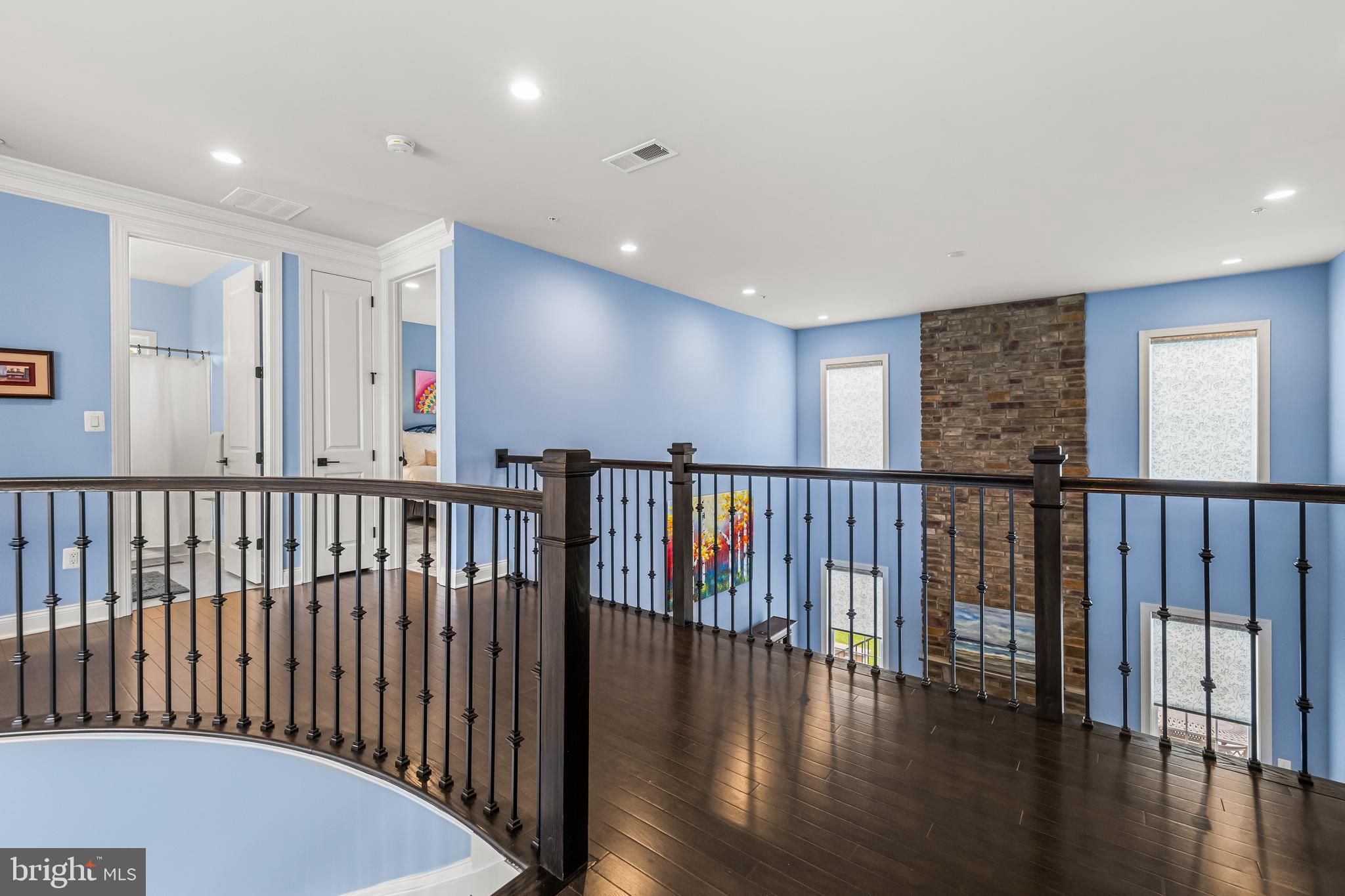 14309 Oak Meadow Road Baldwin, MD 21013 - Photo 45 of 102 a view of staircase with lots of wooden floor and windows