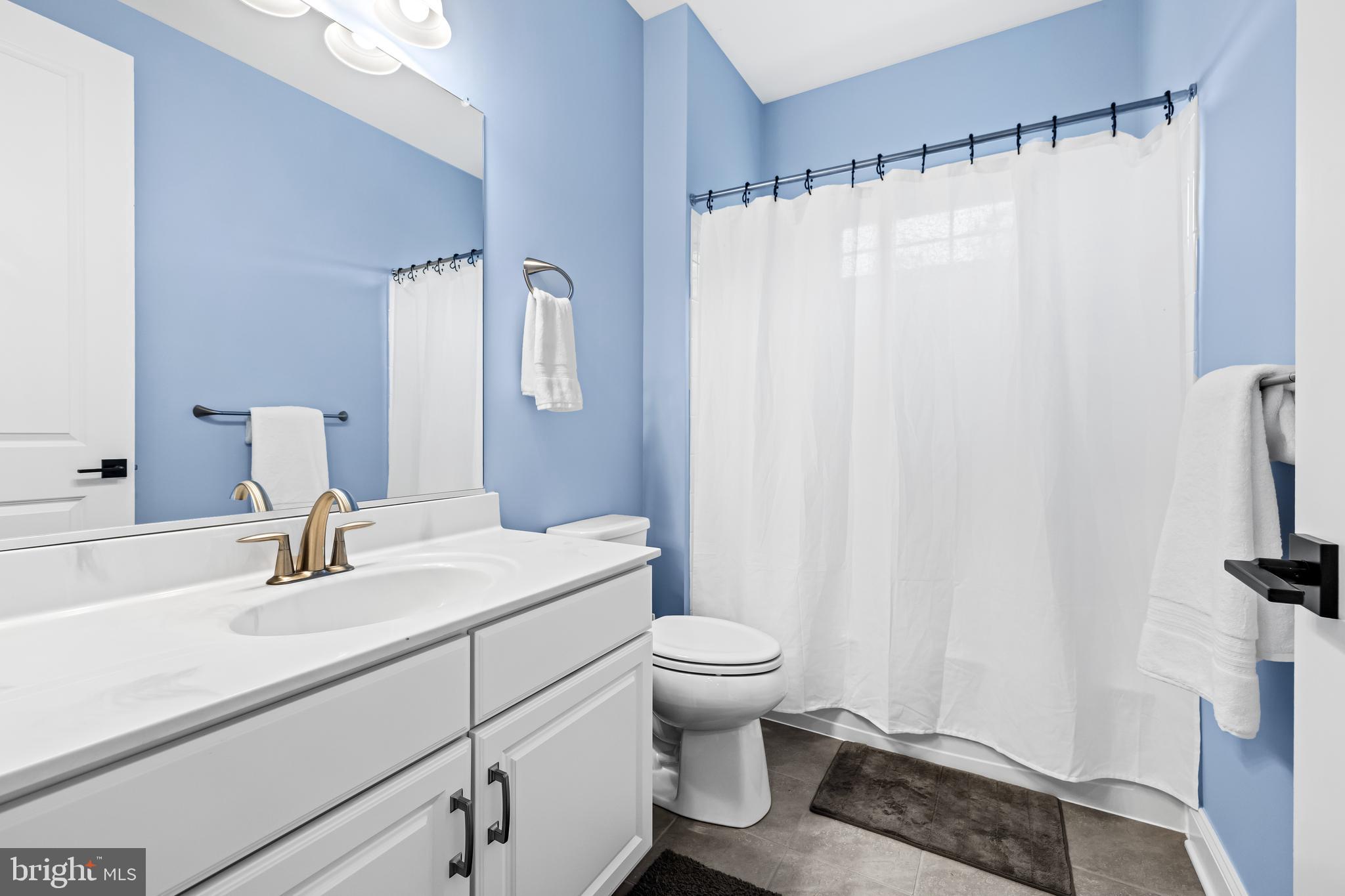 14309 Oak Meadow Road Baldwin, MD 21013 - Photo 49 of 102 a bathroom with a sink toilet and shower