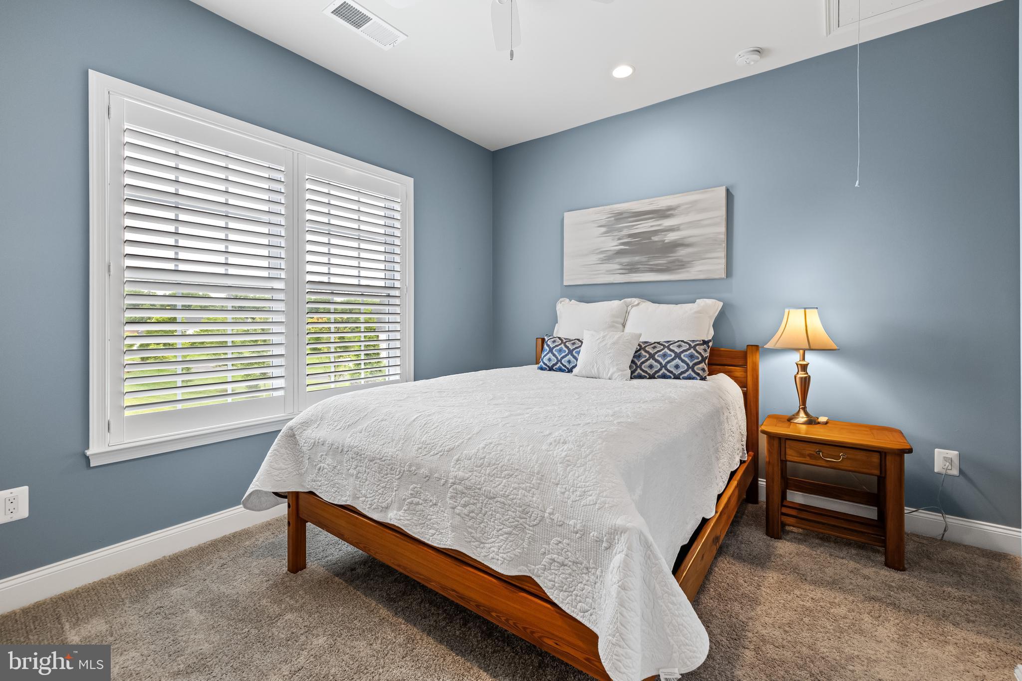 14309 Oak Meadow Road Baldwin, MD 21013 - Photo 51 of 102 a bed sitting in a bedroom next to a window