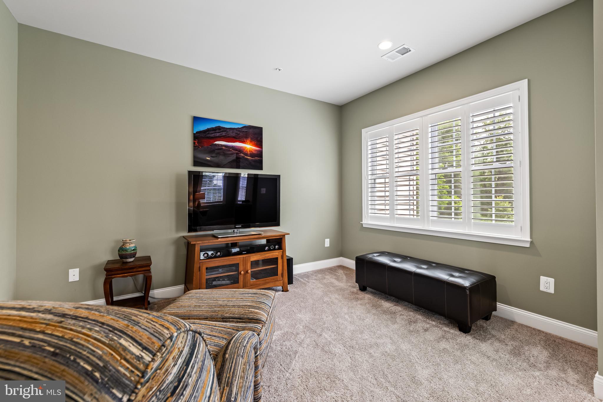 14309 Oak Meadow Road Baldwin, MD 21013 - Photo 64 of 102 a bedroom with a bed and a flat screen tv
