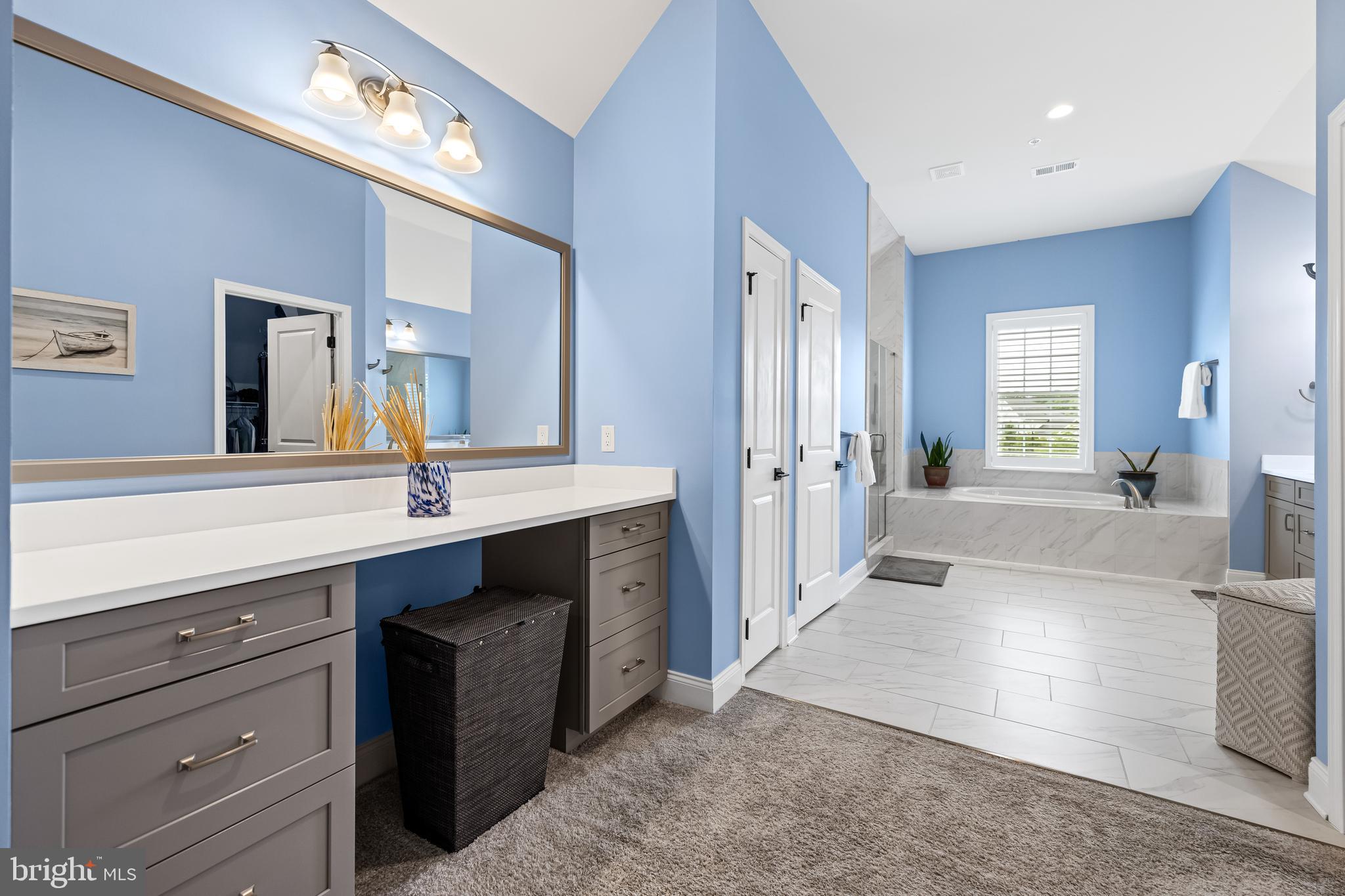 14309 Oak Meadow Road Baldwin, MD 21013 - Photo 67 of 102 a spacious bathroom with a tub double sink and mirror