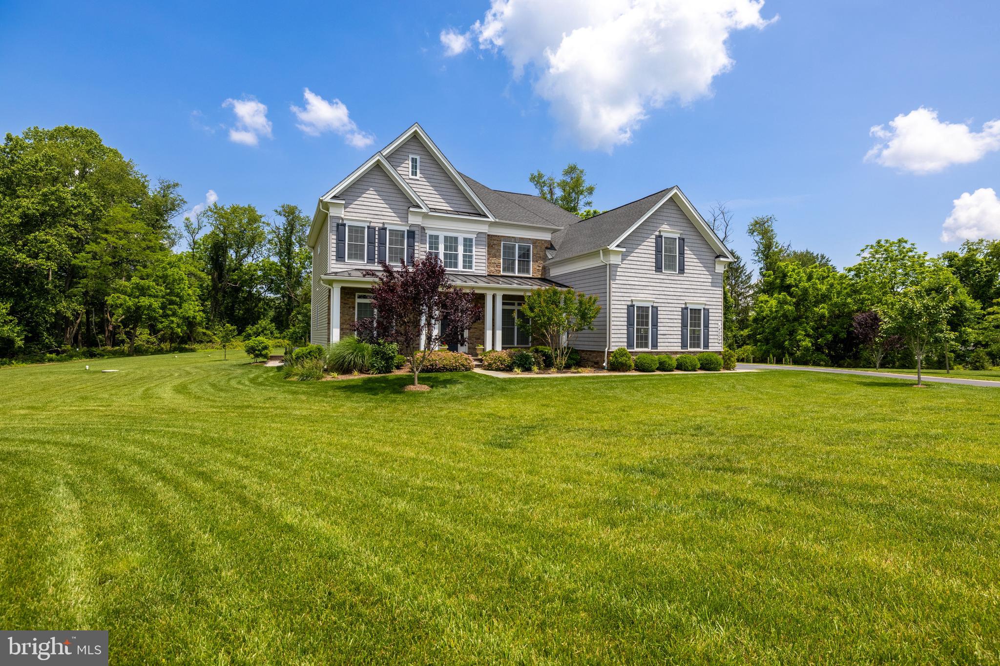 14309 Oak Meadow Road Baldwin, MD 21013 - Photo 7 of 102 a front view of a house with garden