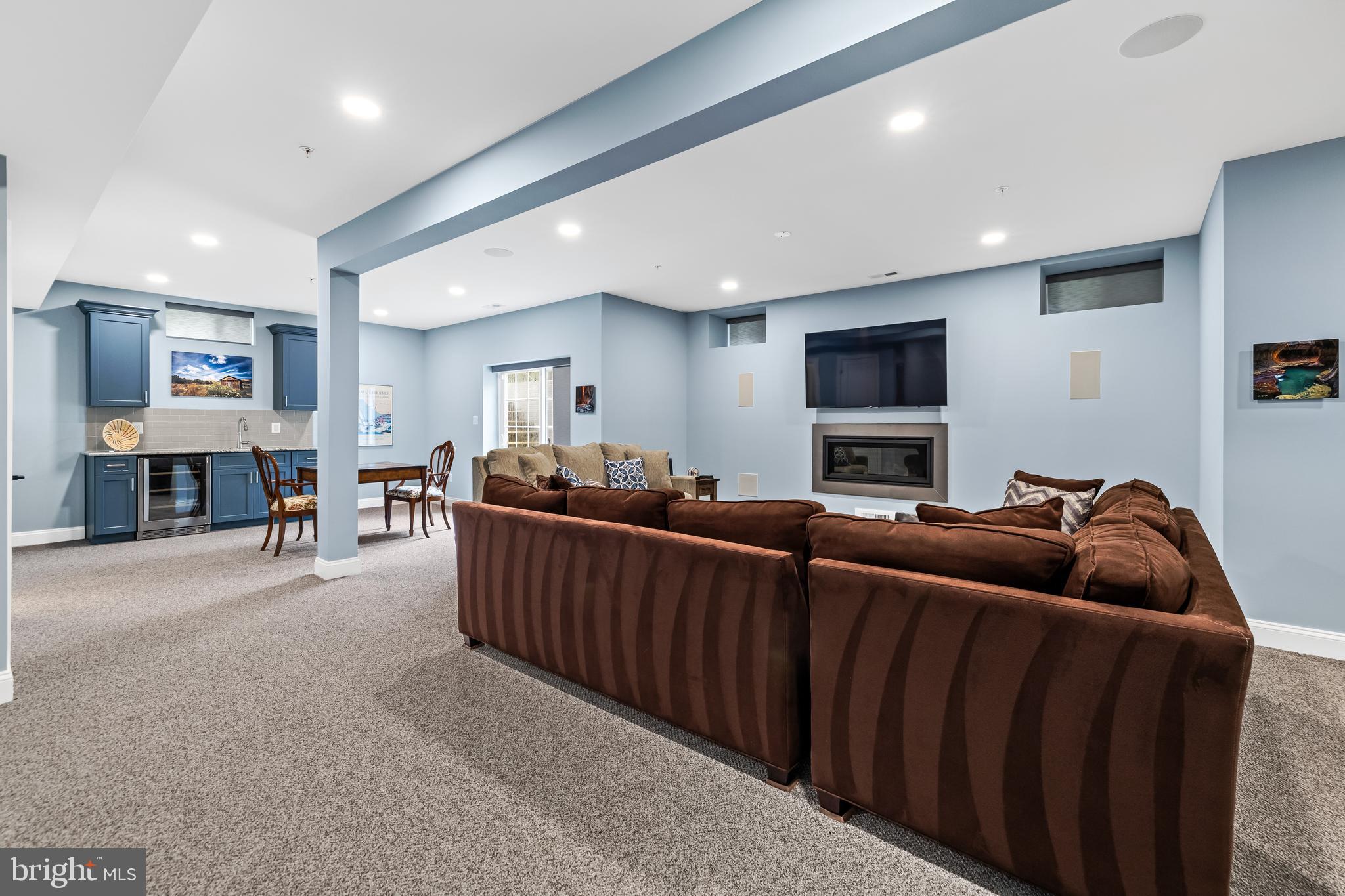 14309 Oak Meadow Road Baldwin, MD 21013 - Photo 79 of 102 a living room with furniture and a flat screen tv