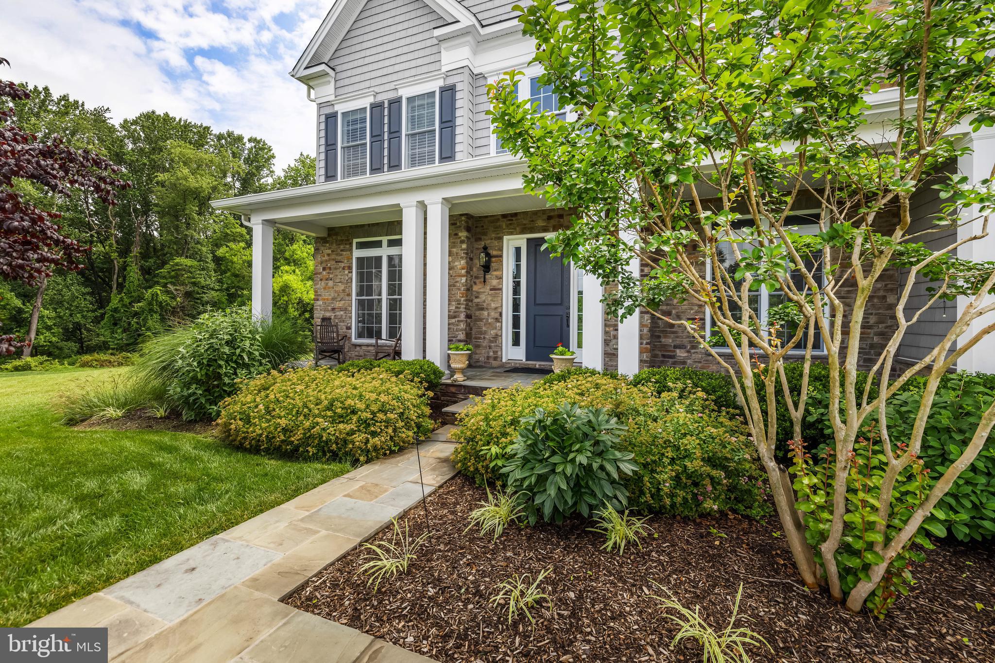 14309 Oak Meadow Road Baldwin, MD 21013 - Photo 9 of 102 a front view of a house with garden
