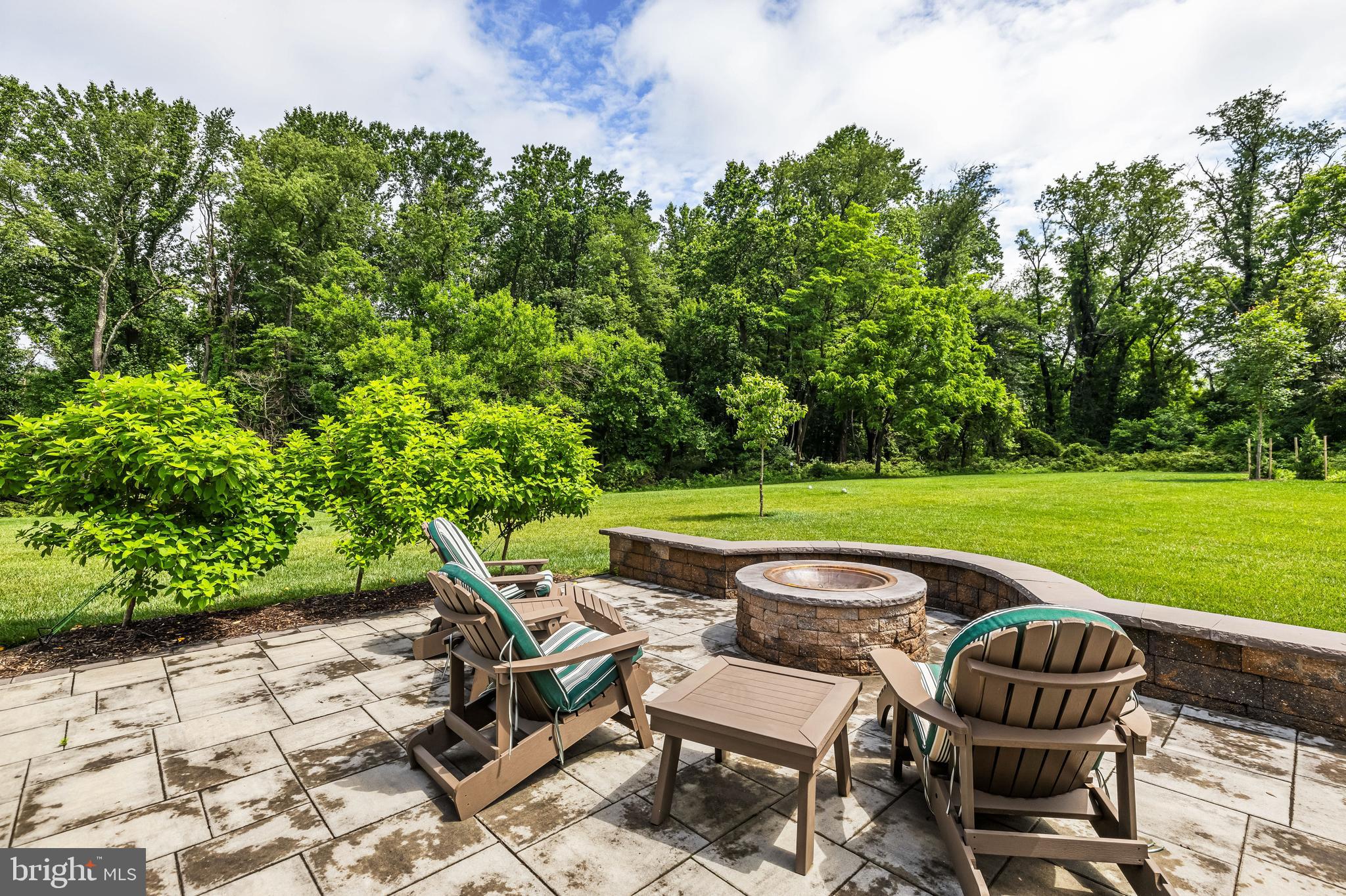 14309 Oak Meadow Road Baldwin, MD 21013 - Photo 93 of 102 a view of a swimming pool and lounge chairs in back yard of the house