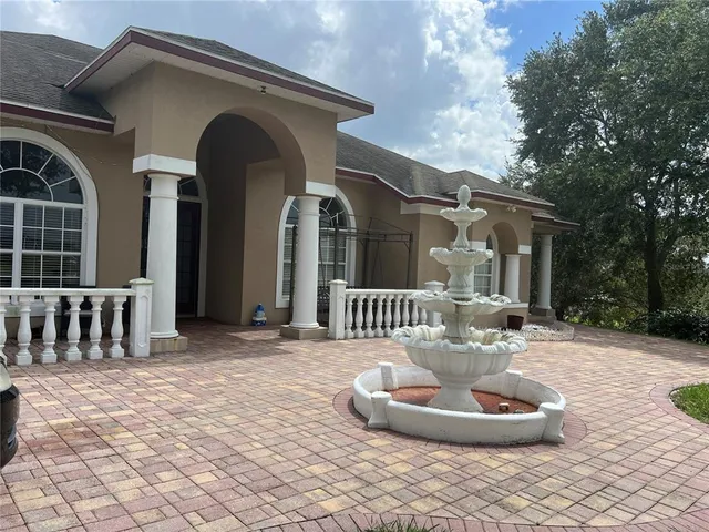 a front view of house with outdoor seating