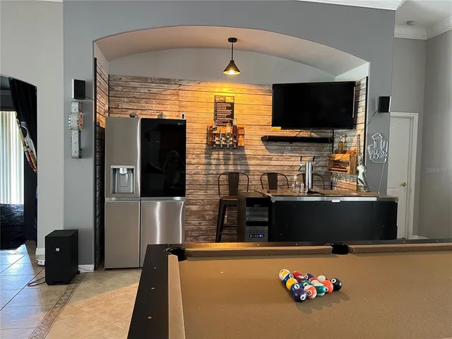 a bedroom with two beds and a window