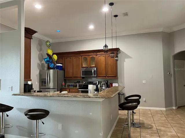 a kitchen with a counter space a sink and appliances