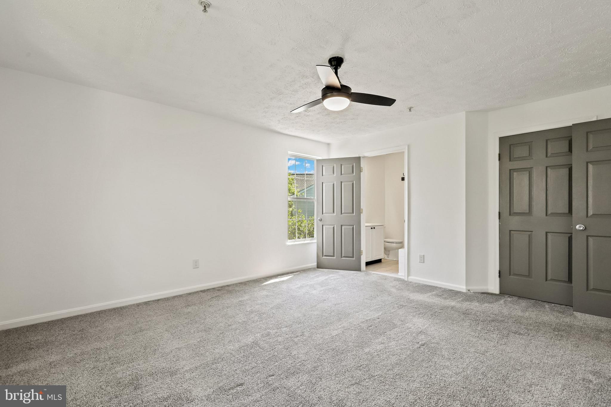 2444 Blue Spring Court, Unit 303 Odenton, MD 21113 - Photo 14 of 33 a view of empty room with windows