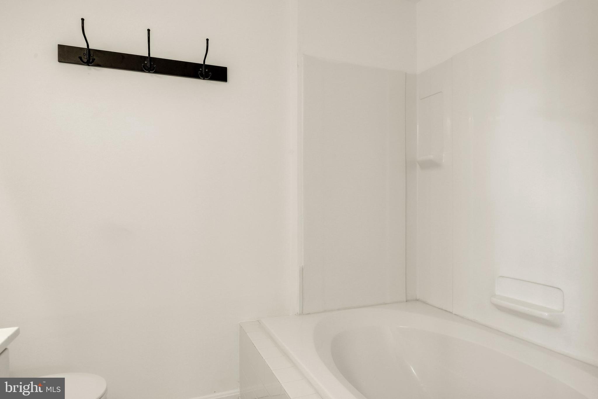 2444 Blue Spring Court, Unit 303 Odenton, MD 21113 - Photo 17 of 33 a bathroom with a bathtub