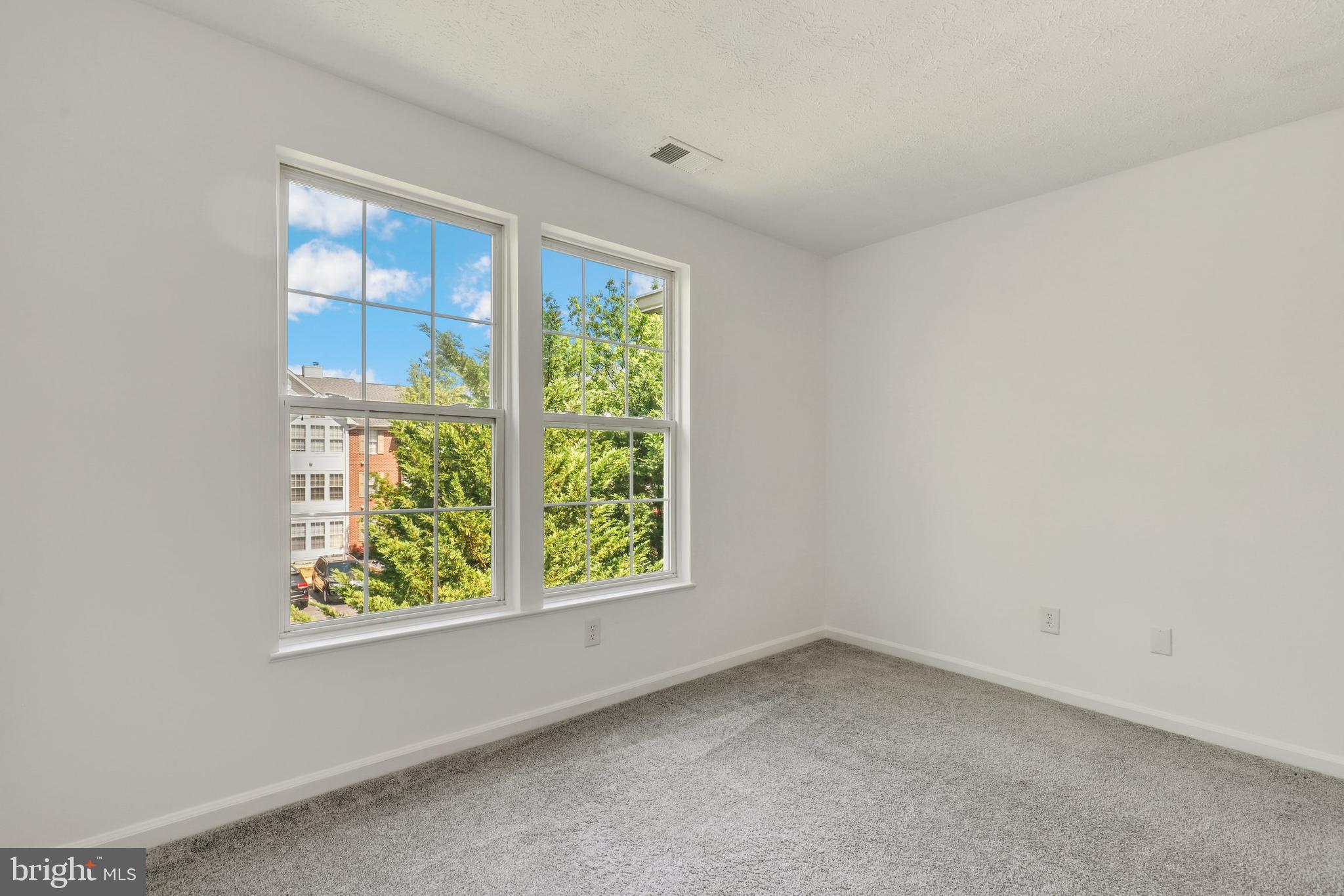 2444 Blue Spring Court, Unit 303 Odenton, MD 21113 - Photo 20 of 33 an empty room with a window