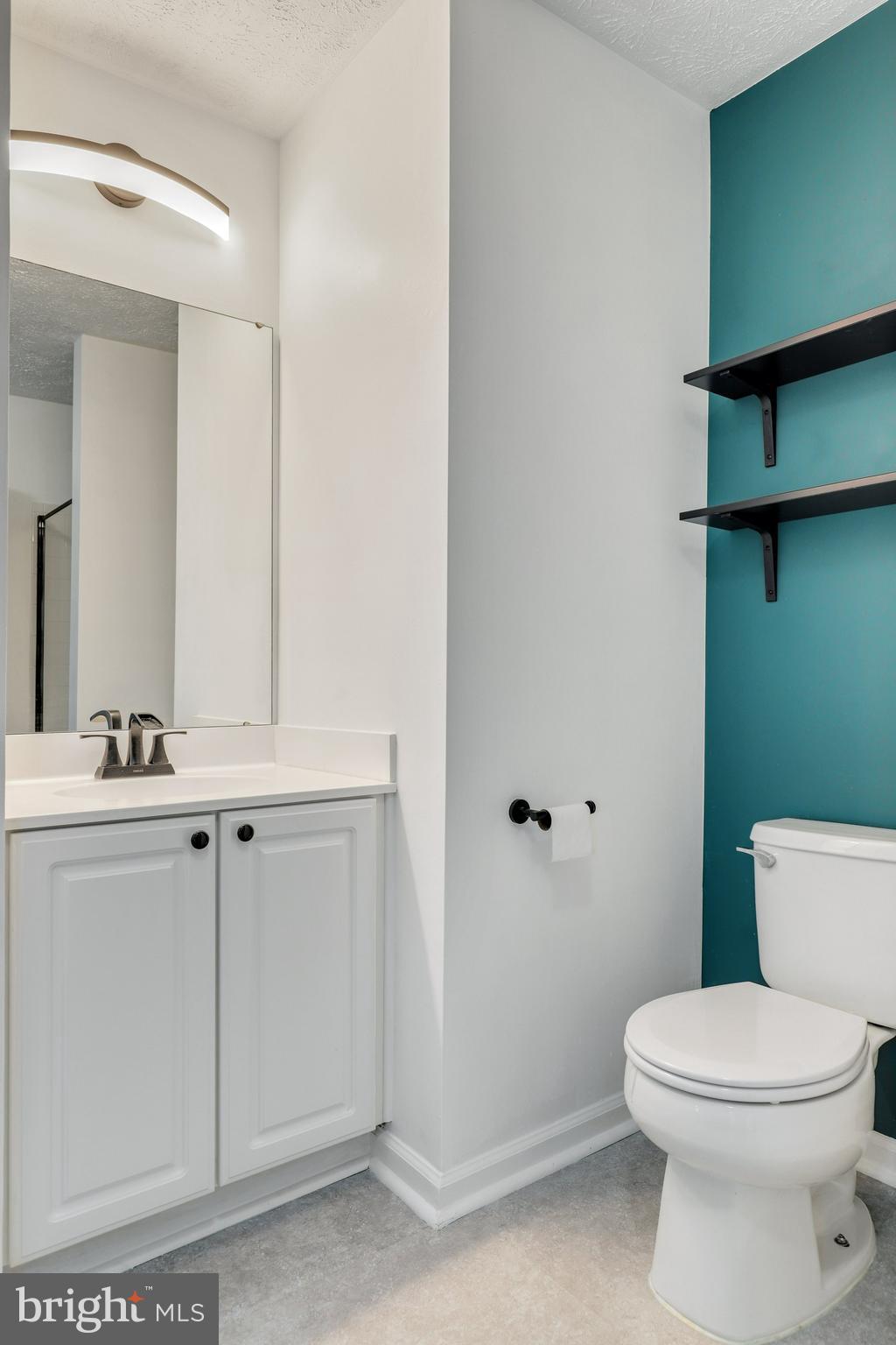 2444 Blue Spring Court, Unit 303 Odenton, MD 21113 - Photo 23 of 33 a bathroom with a toilet sink and mirror
