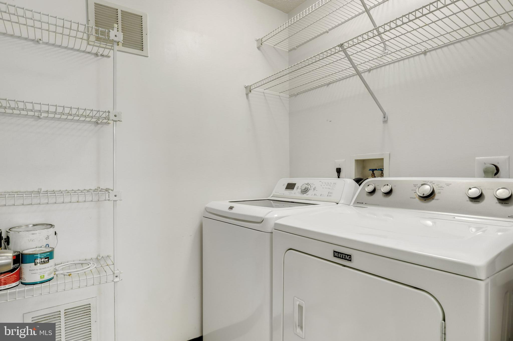 2444 Blue Spring Court, Unit 303 Odenton, MD 21113 - Photo 24 of 33 a utility room with dryer and washer