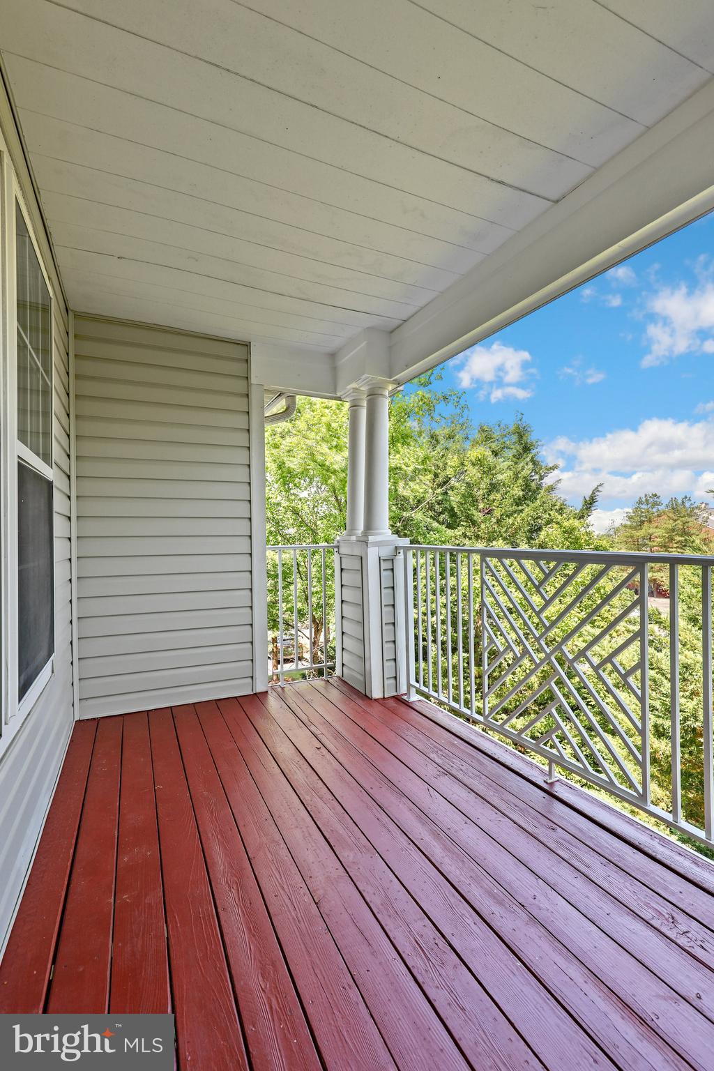 2444 Blue Spring Court, Unit 303 Odenton, MD 21113 - Photo 27 of 33 a view of balcony with wooden floor