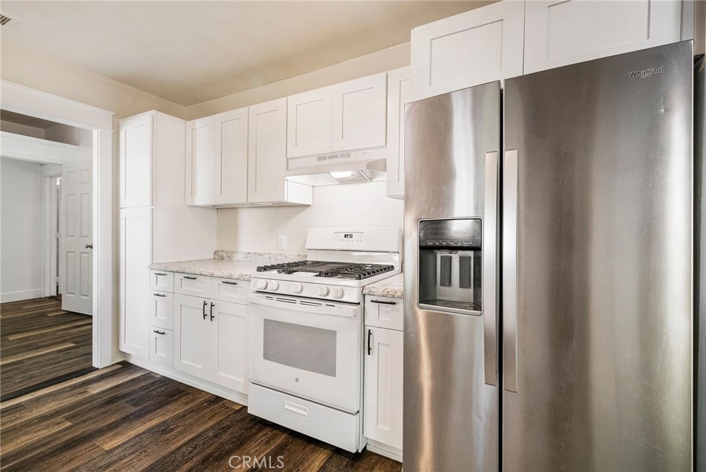 1617 Hemlock Street Chico, CA 95928 - Photo 12 of 60 a kitchen with stainless steel appliances white cabinets and a refrigerator